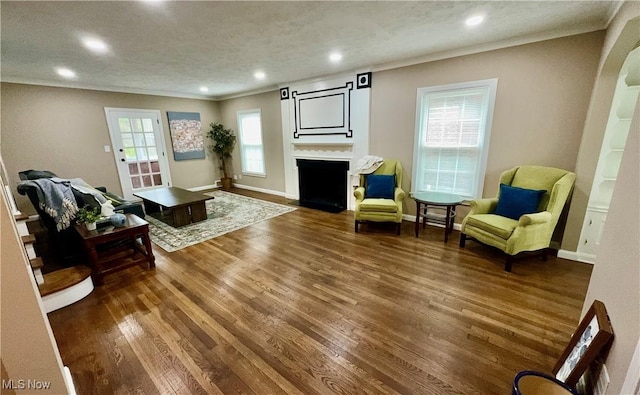 16721 Lomond Blvd, Shaker Heights, OH 44120 - living area with a fireplace with flush hearth, wood finished floors, recessed lighting, and ornamental molding