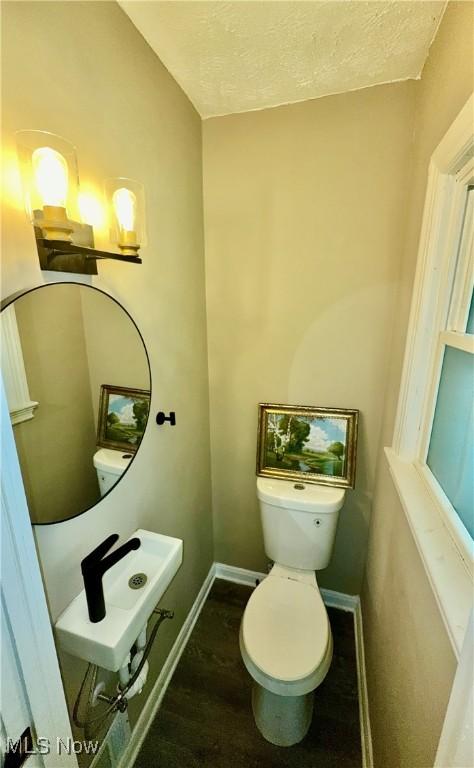 16721 Lomond Blvd, Shaker Heights, OH 44120 - bathroom featuring wood finished floors and a textured ceiling