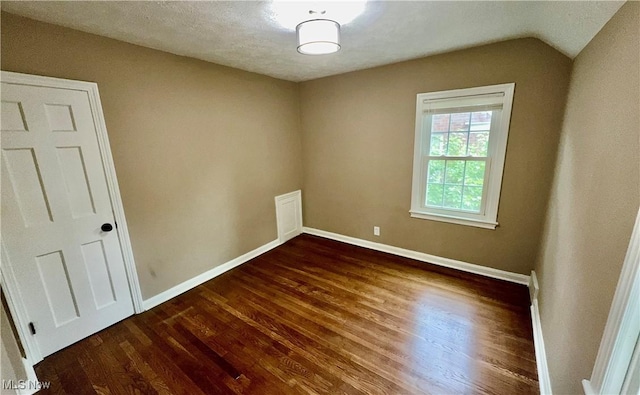 16721 Lomond Blvd, Shaker Heights, OH 44120 - empty room with wood finished floors and lofted ceiling
