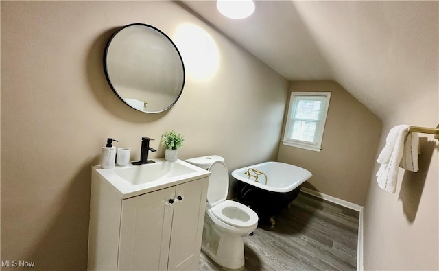16721 Lomond Blvd, Shaker Heights, OH 44120 - bathroom featuring vaulted ceiling, a freestanding tub, wood finished floors, and vanity
