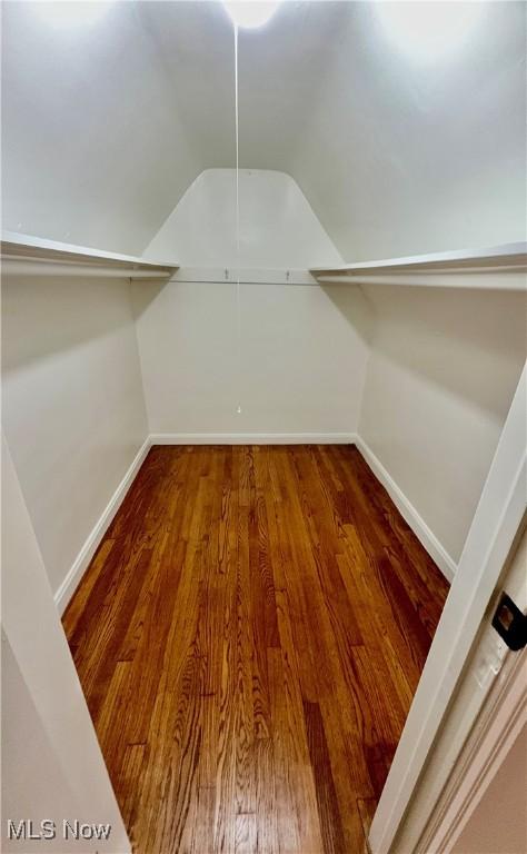 16721 Lomond Blvd, Shaker Heights, OH 44120 - walk in closet featuring wood finished floors and lofted ceiling