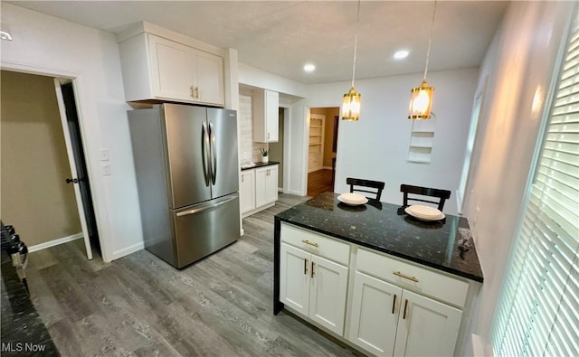 16721 Lomond Blvd, Shaker Heights, OH 44120 - kitchen featuring freestanding refrigerator, dark wood finished floors, white cabinetry, recessed lighting, and dark stone countertops