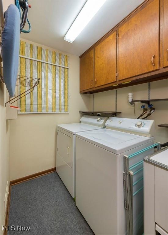 7080 Arcadia Dr, Parma, OH 44129 - washroom featuring cabinet space, washer and dryer, and carpet flooring