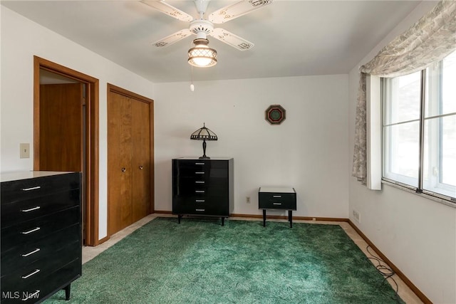 7080 Arcadia Dr, Parma, OH 44129 - carpeted bedroom with a ceiling fan and baseboards
