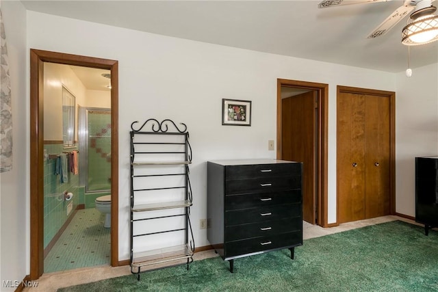 7080 Arcadia Dr, Parma, OH 44129 - bedroom featuring carpet flooring, two closets, ensuite bathroom, and a ceiling fan