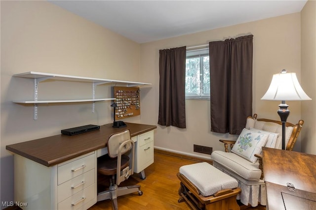 7080 Arcadia Dr, Parma, OH 44129 - home office with wood finished floors and baseboards