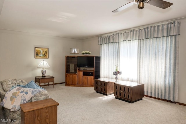 7080 Arcadia Dr, Parma, OH 44129 - carpeted living area with ceiling fan and baseboards