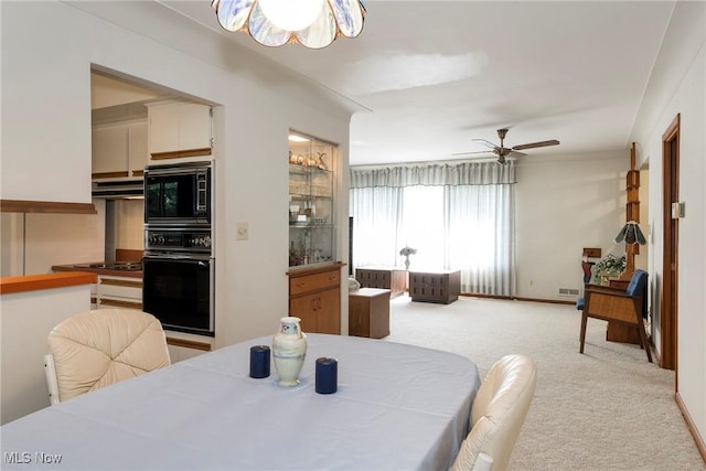 7080 Arcadia Dr, Parma, OH 44129 - dining area with a ceiling fan and light colored carpet