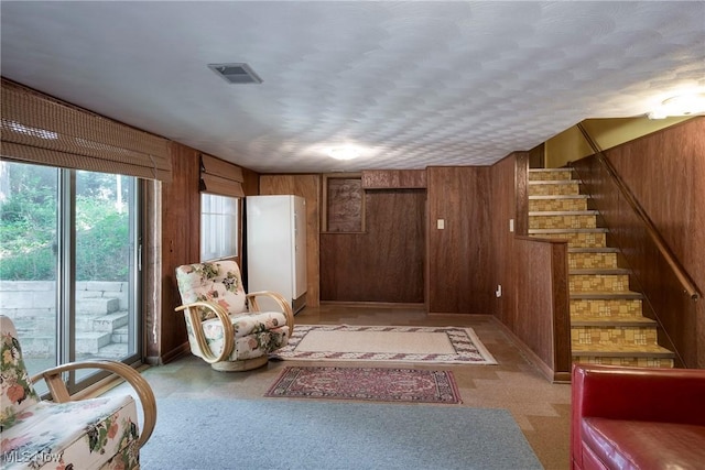 7080 Arcadia Dr, Parma, OH 44129 - sitting room featuring wood walls and stairs