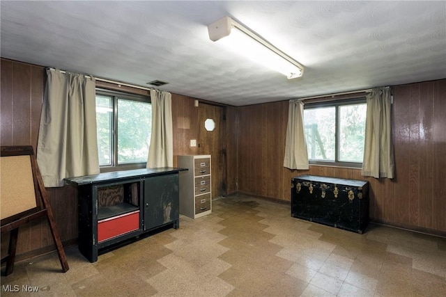 7080 Arcadia Dr, Parma, OH 44129 - living area featuring wood walls and light floors