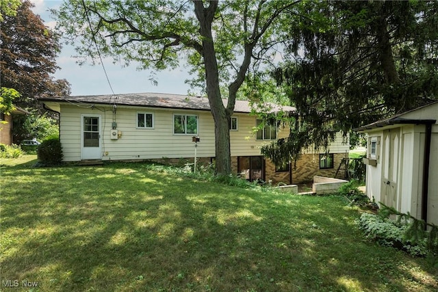 7080 Arcadia Dr, Parma, OH 44129 - rear view of property with a lawn