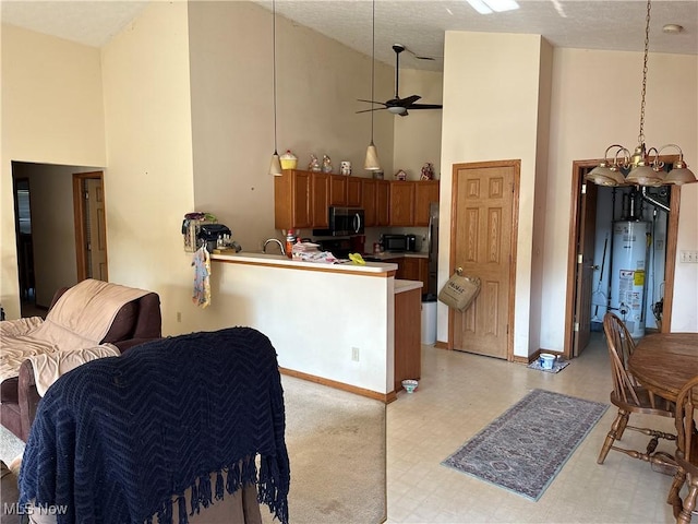 16199 Emerald Pt, Middleburg Heights, OH 44130 - kitchen with high vaulted ceiling, light flooring, open floor plan, water heater, and black appliances