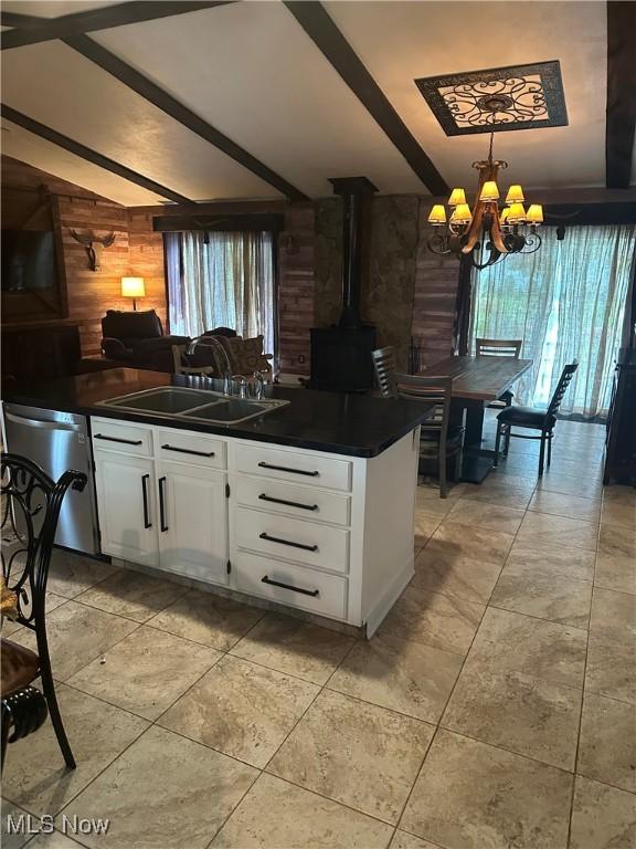 1995 Fox Chase, Youngstown, OH 44515 - kitchen with dishwasher, dark countertops, a chandelier, white cabinetry, and a wood stove