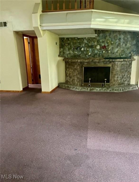 1709 E 29th St, Lorain, OH 44055 - unfurnished living room with a tiled fireplace and carpet