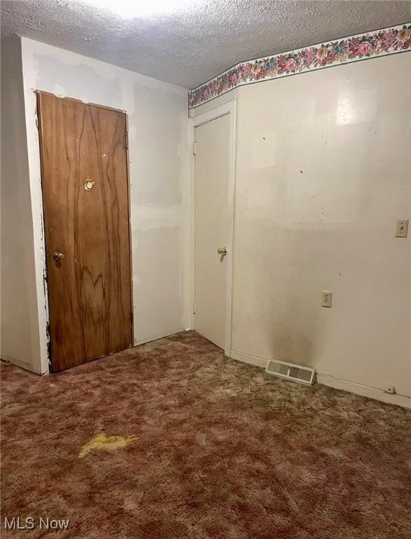 1709 E 29th St, Lorain, OH 44055 - carpeted spare room featuring a textured ceiling