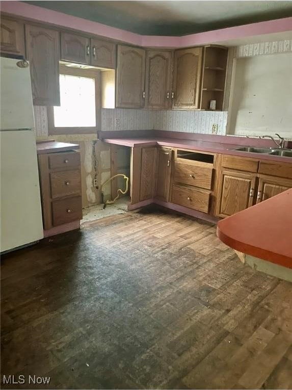 1709 E 29th St, Lorain, OH 44055 - kitchen with freestanding refrigerator, open shelves, and dark wood finished floors