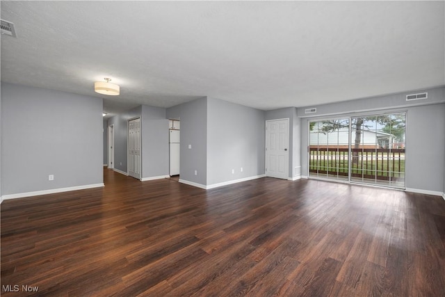 27087 Oakwood Cir Unit 102Y, Olmsted Twp, OH 44138 - spare room featuring baseboards and dark wood-type flooring