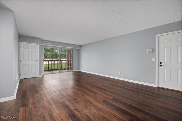 27087 Oakwood Cir Unit 102Y, Olmsted Twp, OH 44138 - unfurnished living room with dark wood-style flooring and baseboards