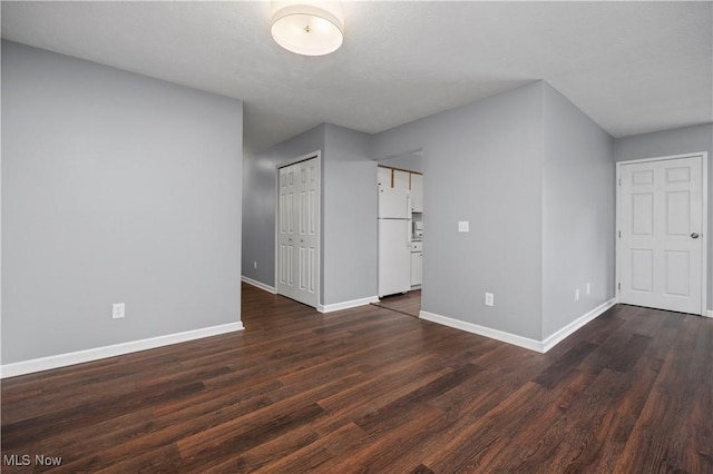 27087 Oakwood Cir Unit 102Y, Olmsted Twp, OH 44138 - unfurnished room with dark wood-style flooring