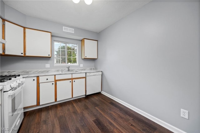 27087 Oakwood Cir Unit 102Y, Olmsted Twp, OH 44138 - kitchen featuring white appliances, dark wood-type flooring, light countertops, and white cabinetry