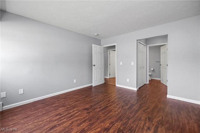 27087 Oakwood Cir Unit 102Y, Olmsted Twp, OH 44138 - unfurnished bedroom with wood finished floors and baseboards