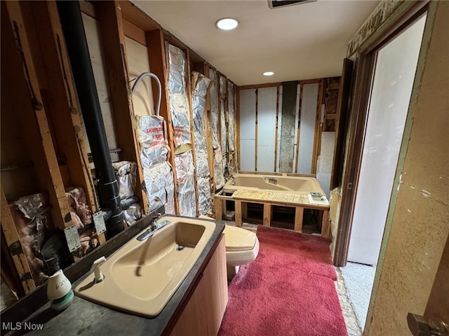 5436 Summerwood Ct Unit C, Willoughby, OH 44094 - bathroom featuring a garden tub, vanity, and recessed lighting