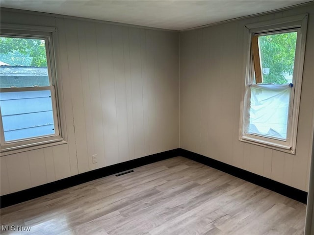 713 N 7th St, Bergholz, OH 43908 - spare room featuring light wood-style floors and healthy amount of natural light