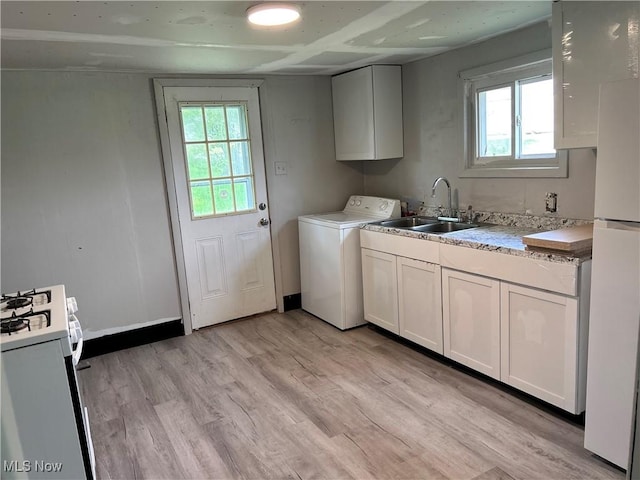 713 N 7th St, Bergholz, OH 43908 - laundry area with washer / clothes dryer, light wood finished floors, and healthy amount of natural light