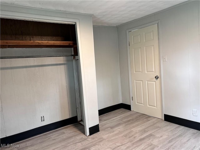 713 N 7th St, Bergholz, OH 43908 - unfurnished bedroom featuring light wood-style flooring and a closet