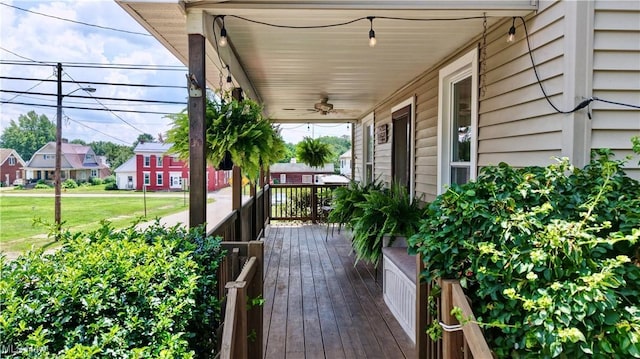99 Mccook Ave, Carrollton, OH 44615 - wooden porch with a ceiling fan and a residential view