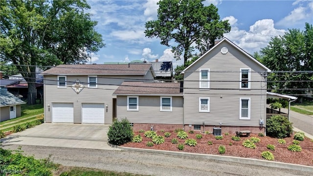 99 Mccook Ave, Carrollton, OH 44615 - view of front of property featuring driveway and an attached garage