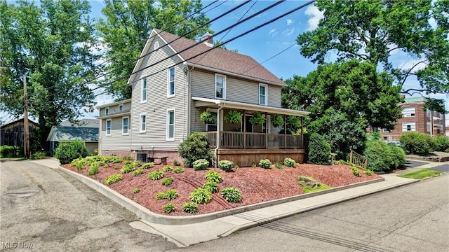 99 Mccook Ave, Carrollton, OH 44615 - view of front of house featuring covered porch and a chimney
