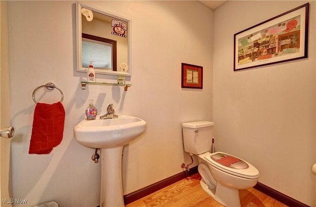 99 Mccook Ave, Carrollton, OH 44615 - bathroom with toilet and wood finished floors