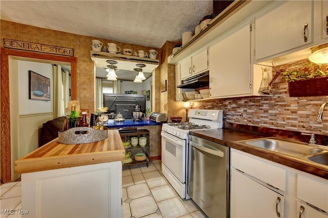 99 Mccook Ave, Carrollton, OH 44615 - kitchen with white range with gas cooktop, stainless steel dishwasher, wood counters, light tile patterned floors, and under cabinet range hood