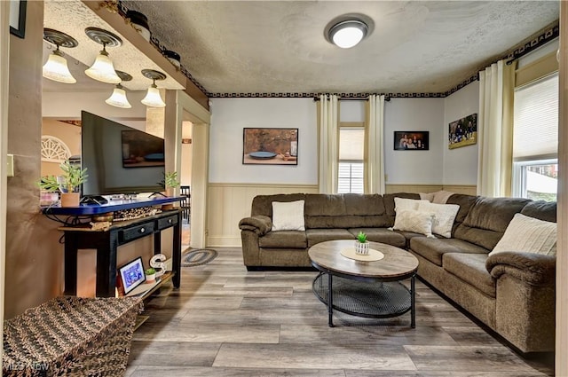 99 Mccook Ave, Carrollton, OH 44615 - living room featuring a wainscoted wall and wood finished floors