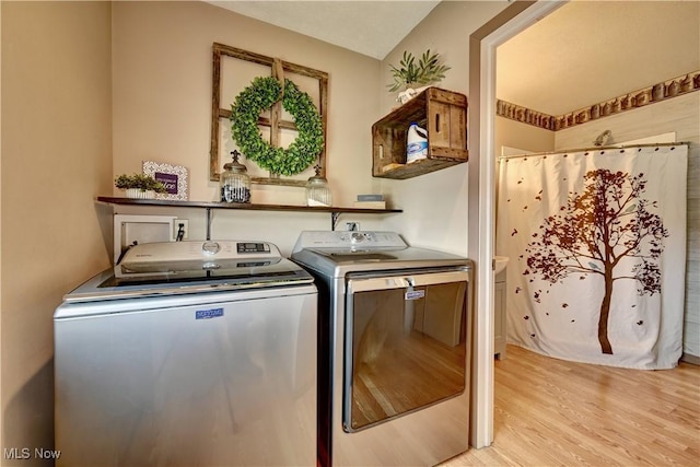 99 Mccook Ave, Carrollton, OH 44615 - laundry area featuring washer and dryer and light wood-style floors