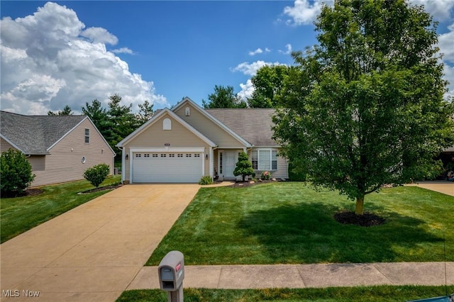 1446 Chesapeake Ave, Louisville, OH 44641 - view of front of house with an attached garage, a front yard, and concrete driveway
