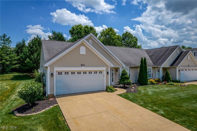1446 Chesapeake Ave, Louisville, OH 44641 - single story home featuring an attached garage, driveway, and a front yard