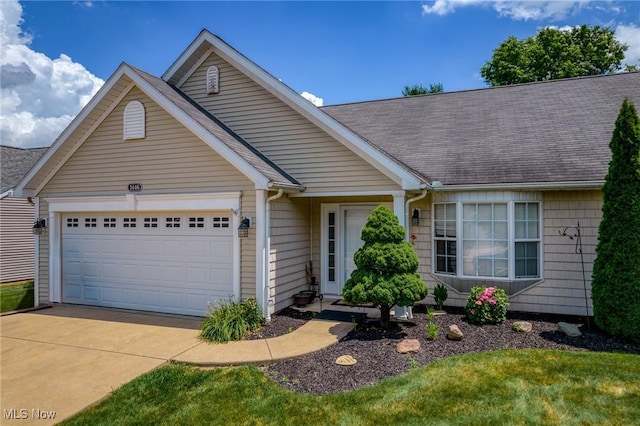1446 Chesapeake Ave, Louisville, OH 44641 - ranch-style home featuring driveway, a garage, and a shingled roof