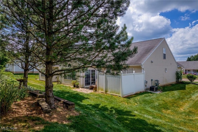 1446 Chesapeake Ave, Louisville, OH 44641 - view of side of home featuring a yard and a shingled roof