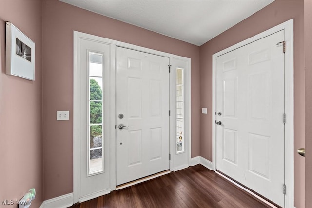 1446 Chesapeake Ave, Louisville, OH 44641 - entrance foyer featuring baseboards and dark wood-style flooring