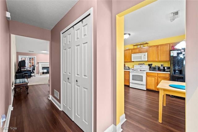 1446 Chesapeake Ave, Louisville, OH 44641 - hall with dark wood finished floors
