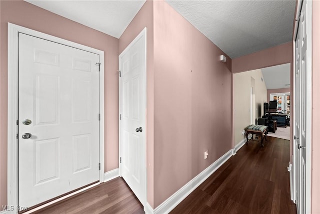 1446 Chesapeake Ave, Louisville, OH 44641 - foyer entrance featuring dark wood-style flooring and baseboards