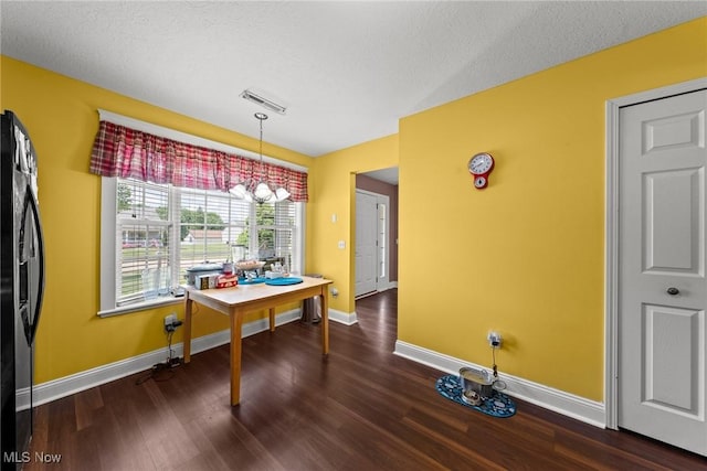 1446 Chesapeake Ave, Louisville, OH 44641 - dining room featuring baseboards and dark wood-style floors