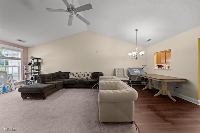 1446 Chesapeake Ave, Louisville, OH 44641 - living room with vaulted ceiling, a chandelier, a ceiling fan, and wood finished floors