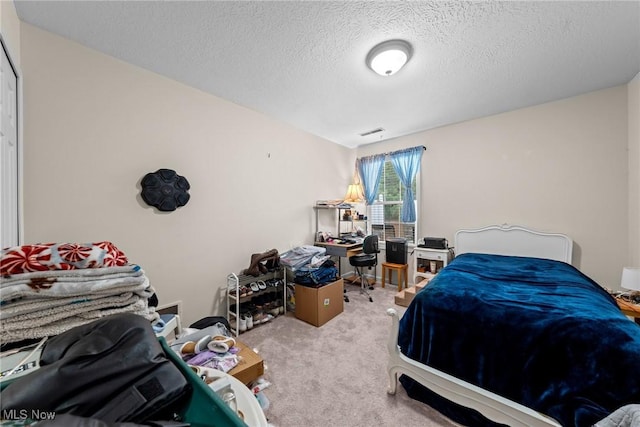 1446 Chesapeake Ave, Louisville, OH 44641 - carpeted bedroom with a desk and a textured ceiling