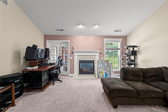 1446 Chesapeake Ave, Louisville, OH 44641 - living room featuring carpet floors, an office area, and a brick fireplace