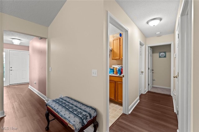 1446 Chesapeake Ave, Louisville, OH 44641 - hall featuring a textured ceiling and dark wood-style floors