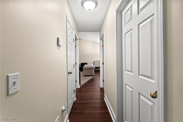 1446 Chesapeake Ave, Louisville, OH 44641 - hall with dark wood-style flooring and baseboards