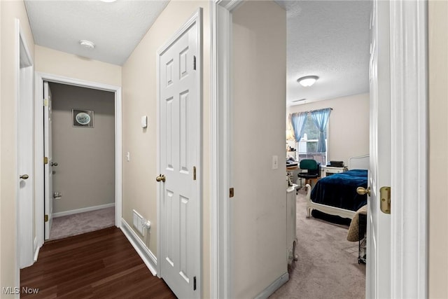 1446 Chesapeake Ave, Louisville, OH 44641 - corridor with a desk, a textured ceiling, and wood finished floors